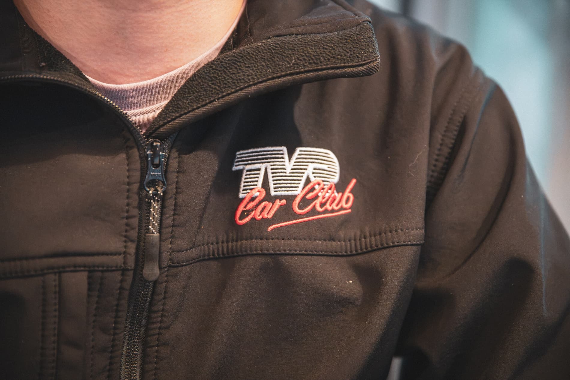 Close-up of a TVR Car Club logo stitched on a black jacket.