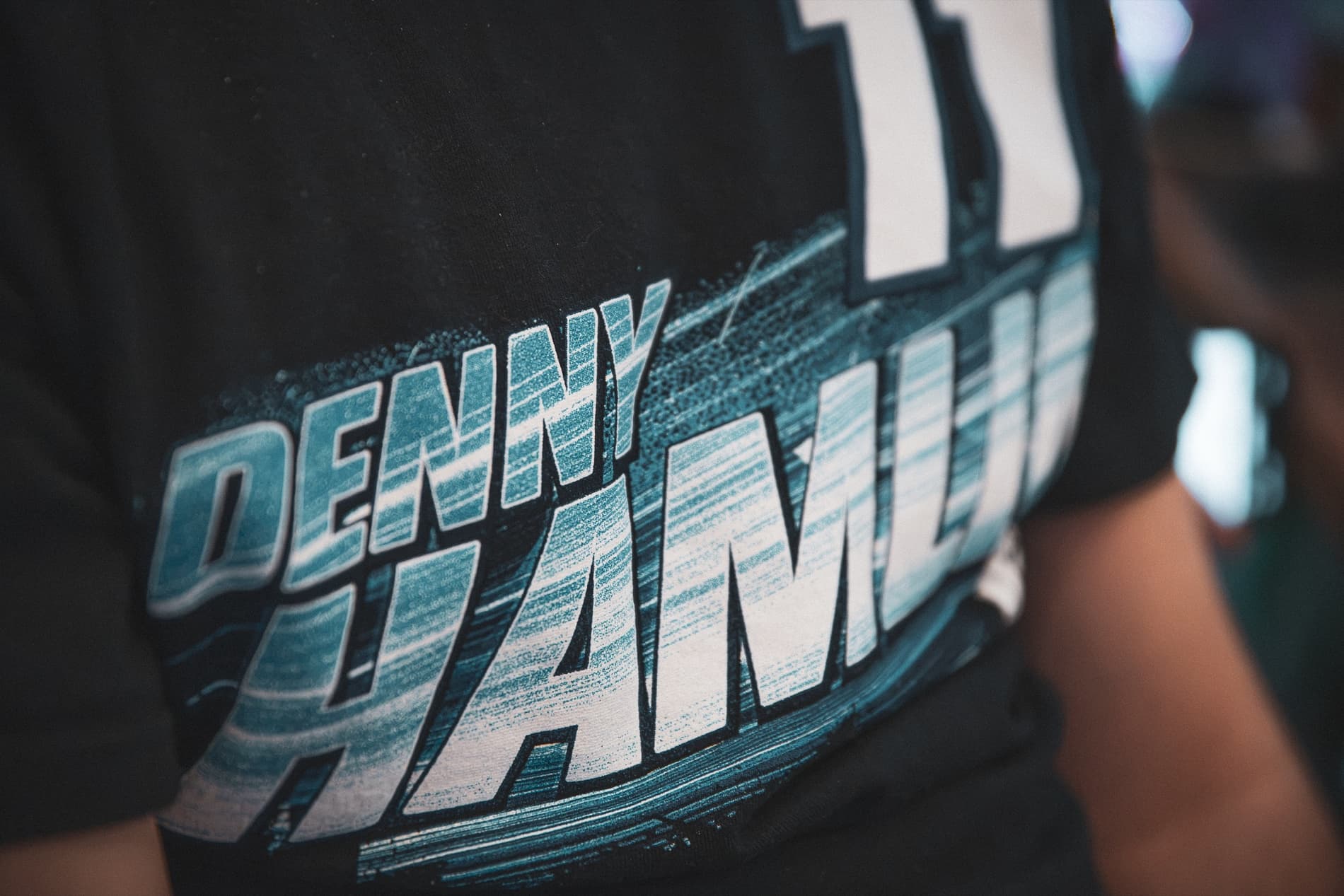 Close-up of a black Denny Hamlin No. 11 T-shirt.