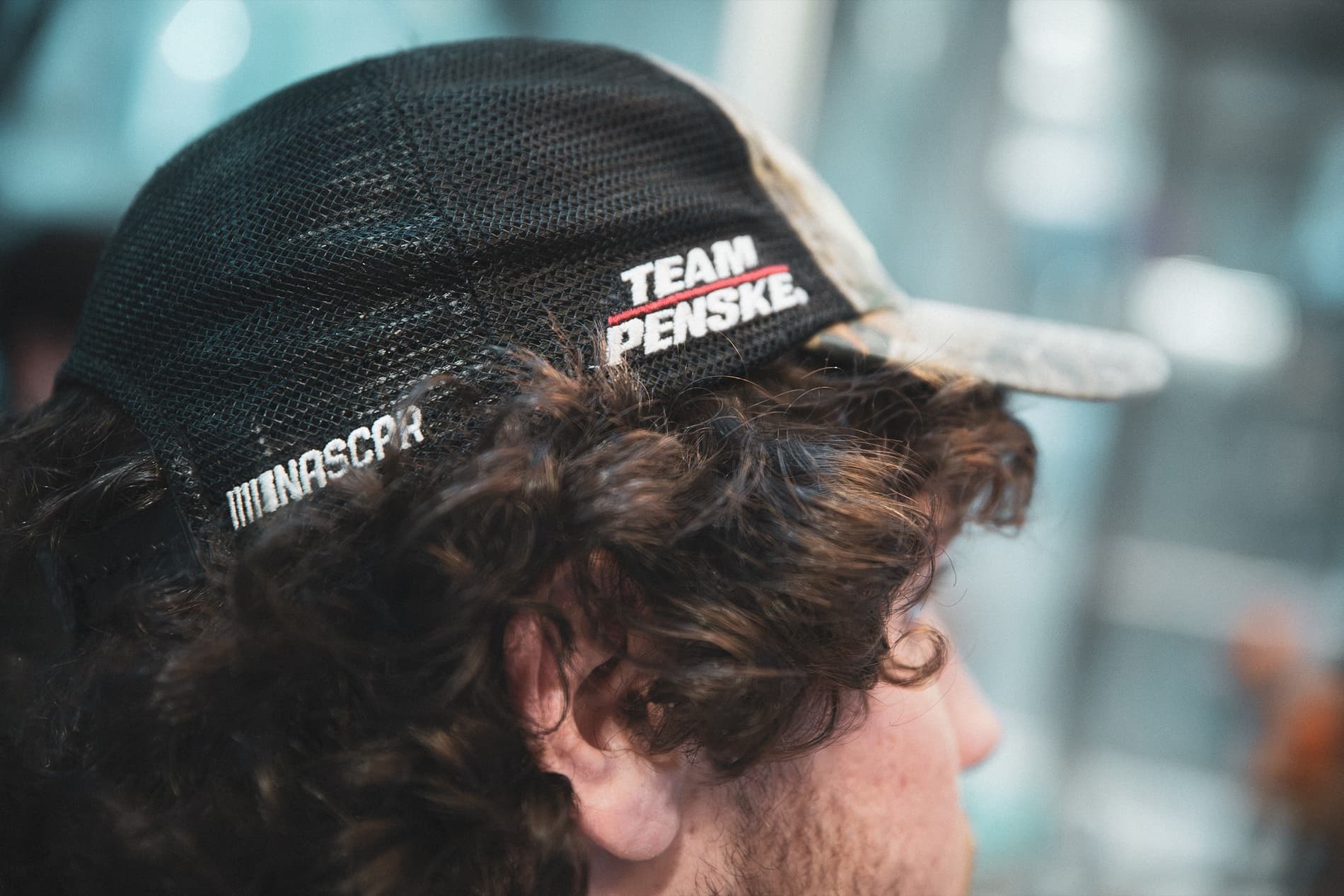 The back of a Team Penske mesh cap with a NASCAR logo.
